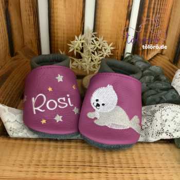 Name mit Sternen und Robbe