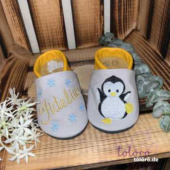 Name mit Schneeflocken und Pinguin