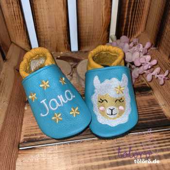Name mit Blumen und Alpaka/Lama