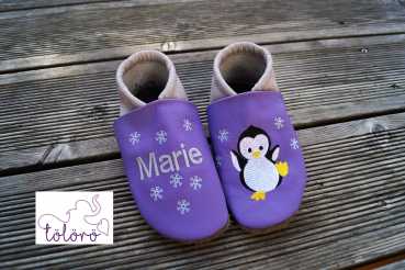 Name mit Schneeflocken und Pinguin