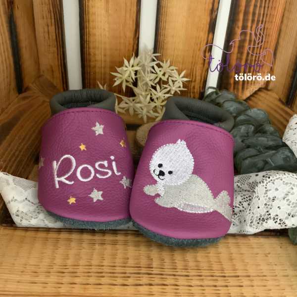 Name mit Sternen und Robbe