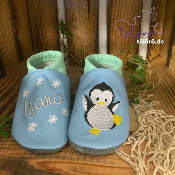 Name mit Schneeflocken und Pinguin