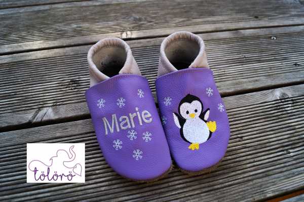 Name mit Schneeflocken und Pinguin