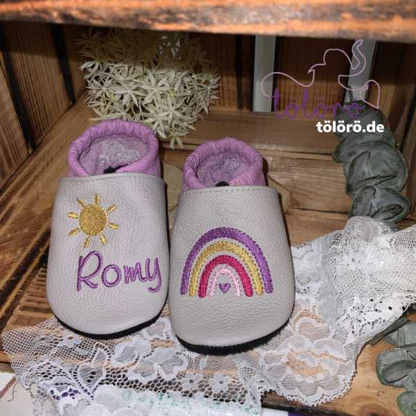 Name mit Sonne und Regenbogen